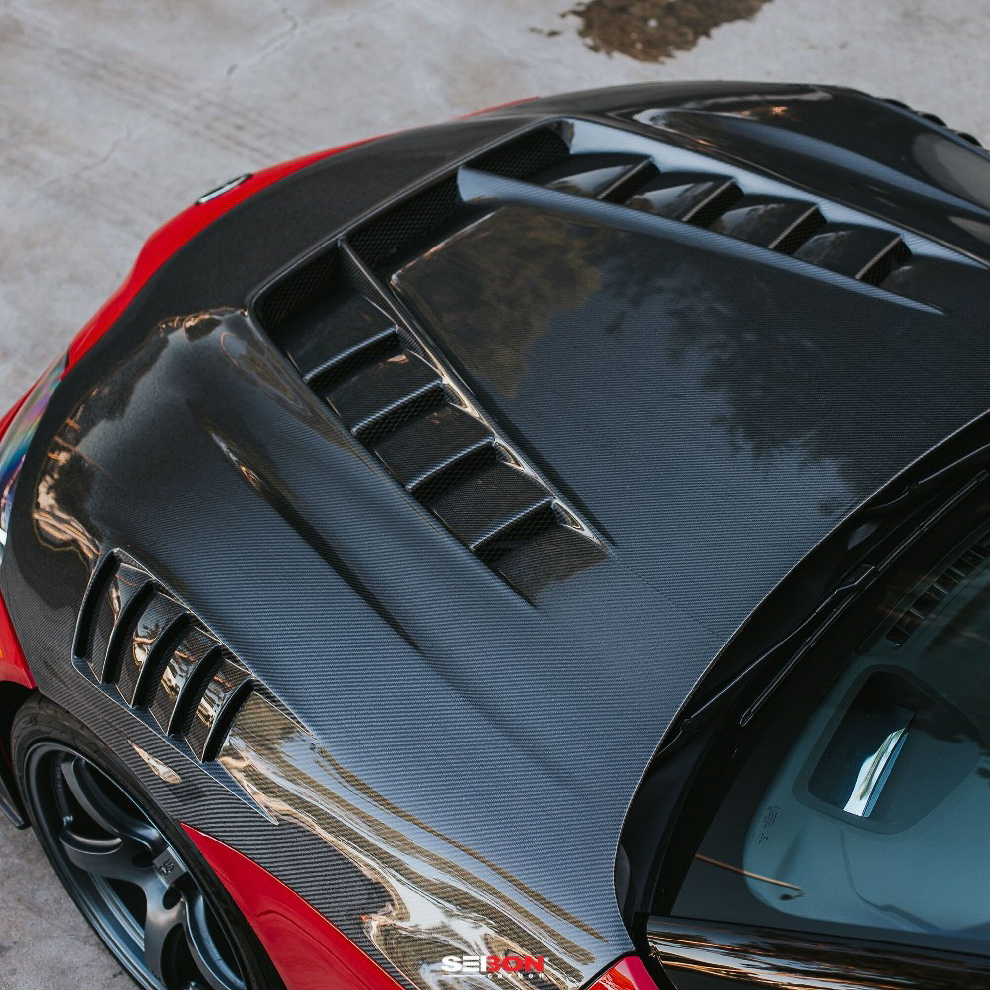 2020-2024 Toyota GR Supra TV Style double Sided Carbon Fiber Hood by Seibon